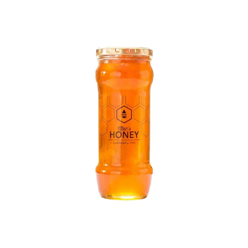 Pure raw orange blossom honey in a jar with honeycomb, showcasing its golden color and natural goodness.