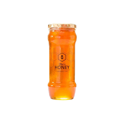 Pure raw orange blossom honey in a jar with honeycomb, showcasing its golden color and natural goodness.
